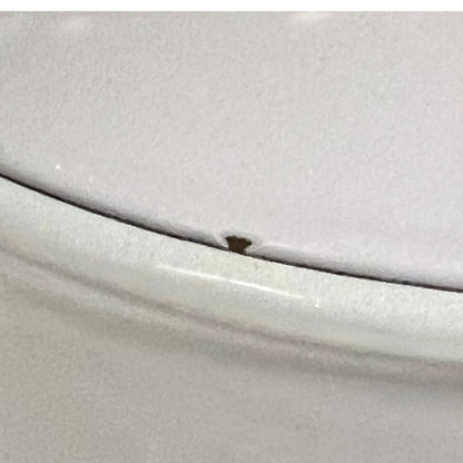 Close up of a Le Creuset pot on a white background