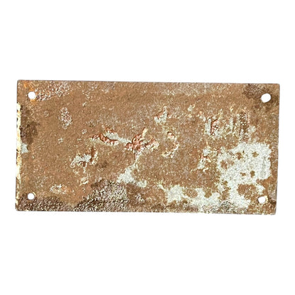Rust-colored metal plate with a textured surface on a white background