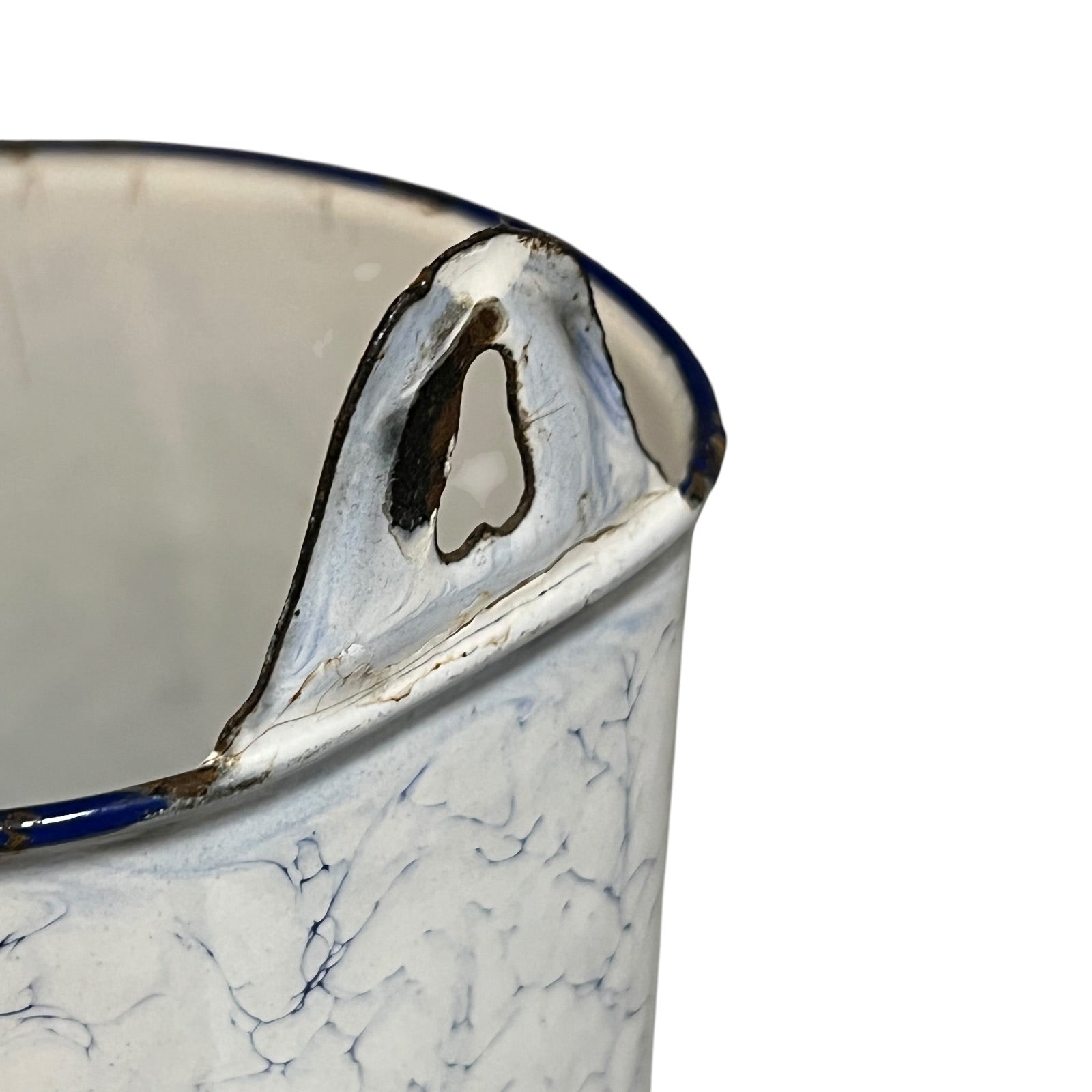 Close up of a French enamel vintage garden wall mounted planter or kitchen bathroom storage pot, on a white background 
