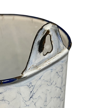 Close up of a French enamel vintage garden wall mounted planter or kitchen bathroom storage pot, on a white background 