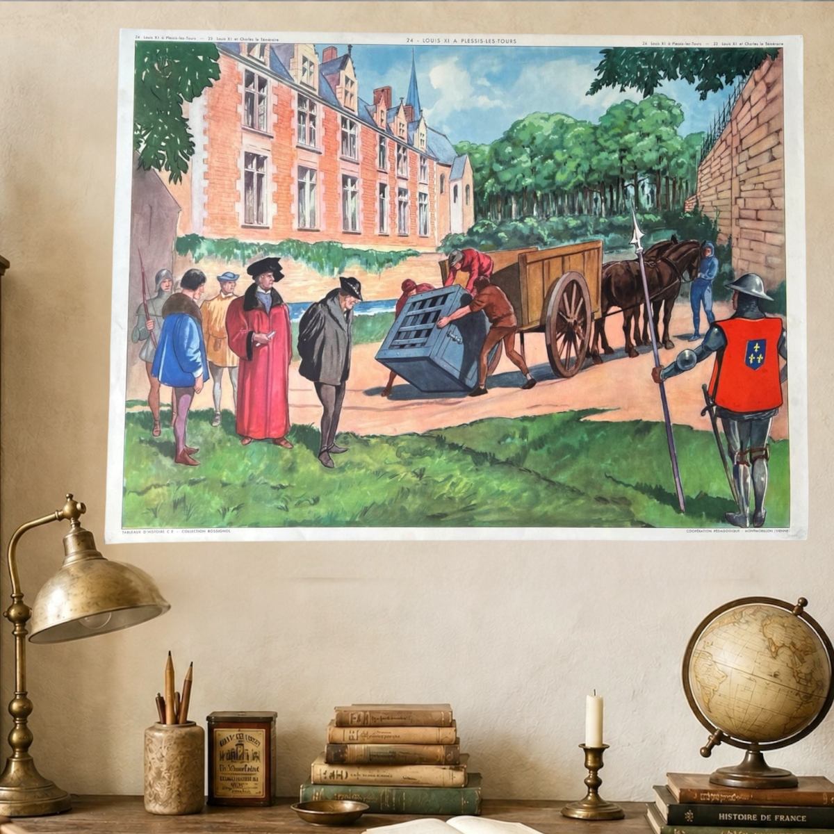 A framed art print depicting a historical scene with figures, a horse-drawn cart, and a large brick building, displayed on a beige wall above a desk with books, a lamp, and a globe.