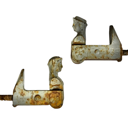 Two vintage metal hardware pieces with a weathered white-painted finish and extensive rust, shown against a plain white background.
