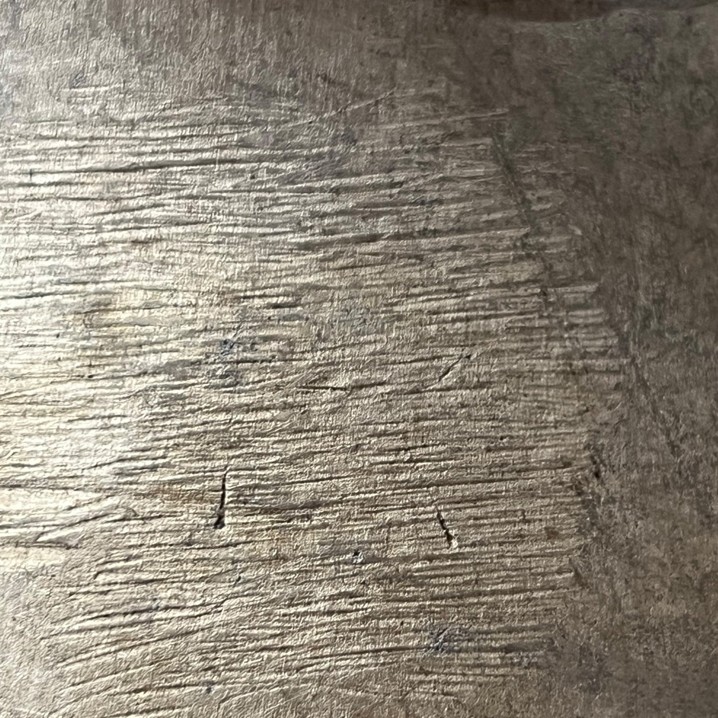 Close-up of a textured metal surface of milk churn
