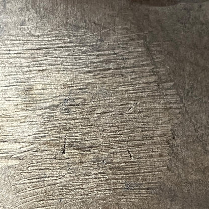 Close-up of a textured metal surface of milk churn