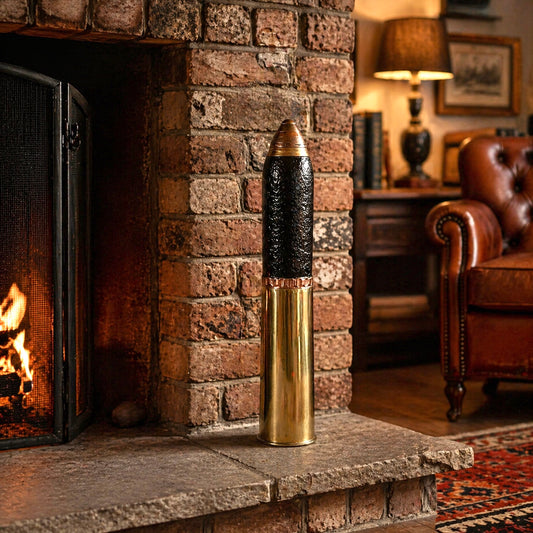 British WW1 18 pounder militaria relic trench art, a brass shell, a black shrapnel case and a brass fuse, upright, for display or militaria gift, on a fireplace in a warm coy room setting