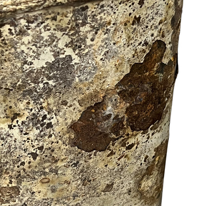 close up of a rusty water bottle on a white background 