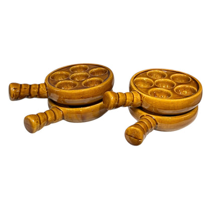 French brown ceramic escargots pots with multiple compartments on a white background