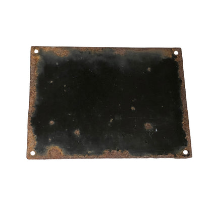 A rectangular black metal plate with rounded corners and four pre-drilled holes, showing significant rust and weathering along the edges, isolated on a white background.
