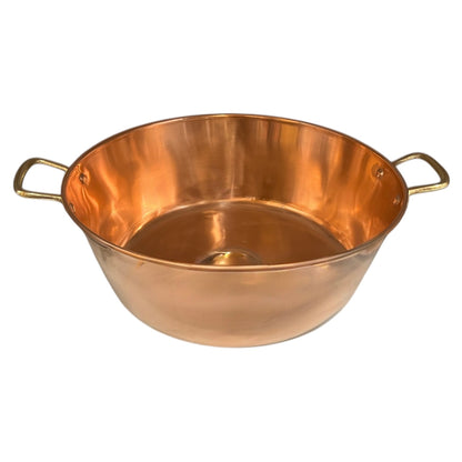 Copper bowl with handles on a white background
