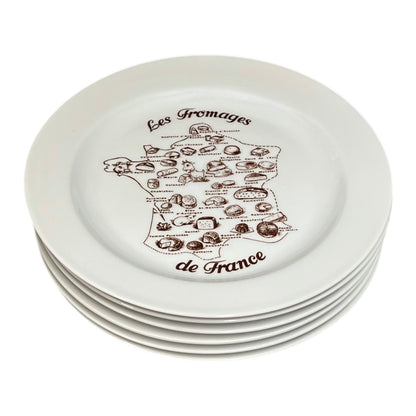 Set of white plates with black cheese illustration and text on a white background