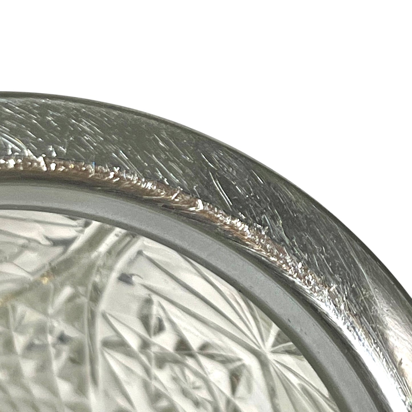 Close up of a decorative glass vintage ice bucket on a white background