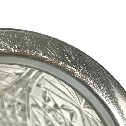 Close up of a decorative glass vintage ice bucket on a white background