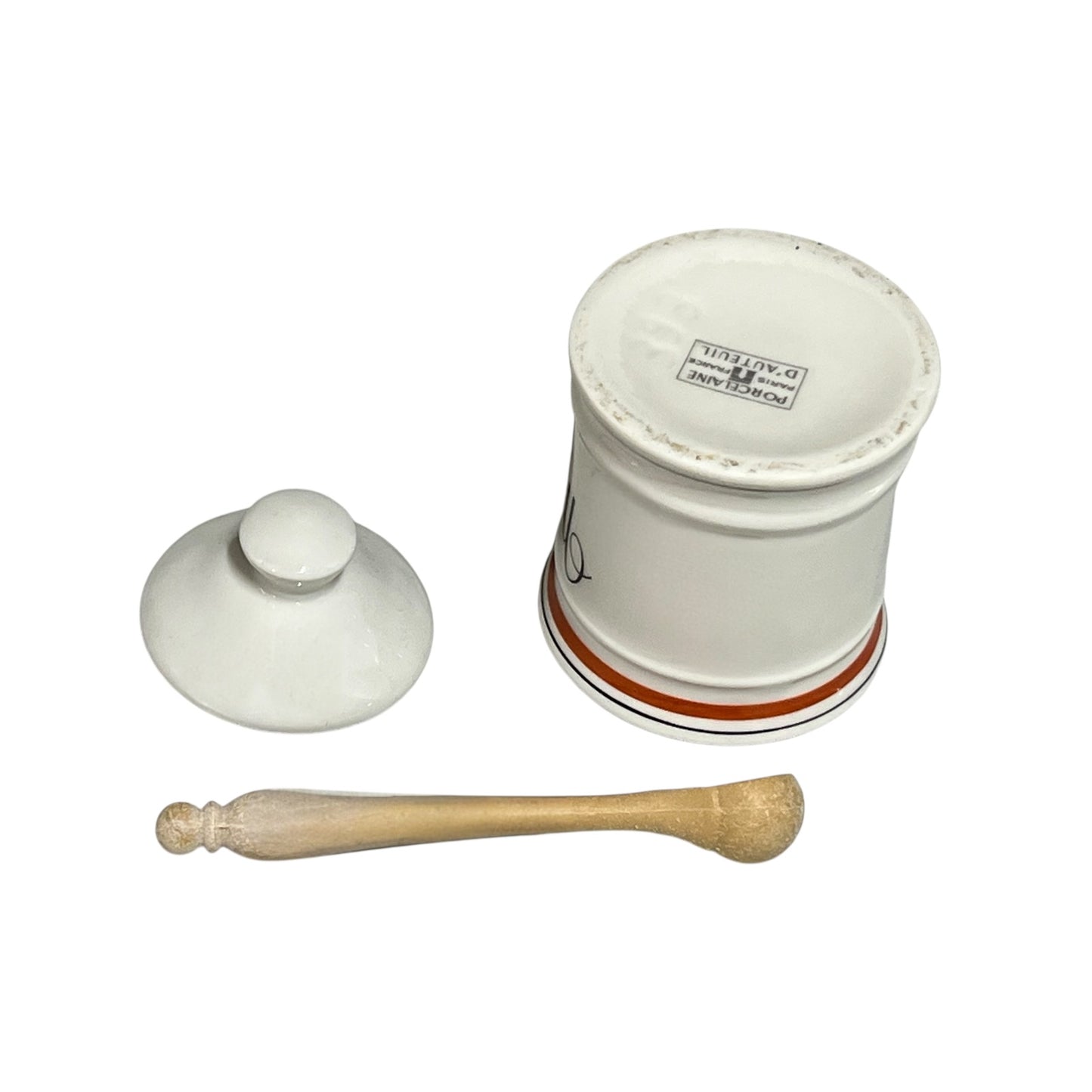 White ceramic mortar and pestle set on a white background