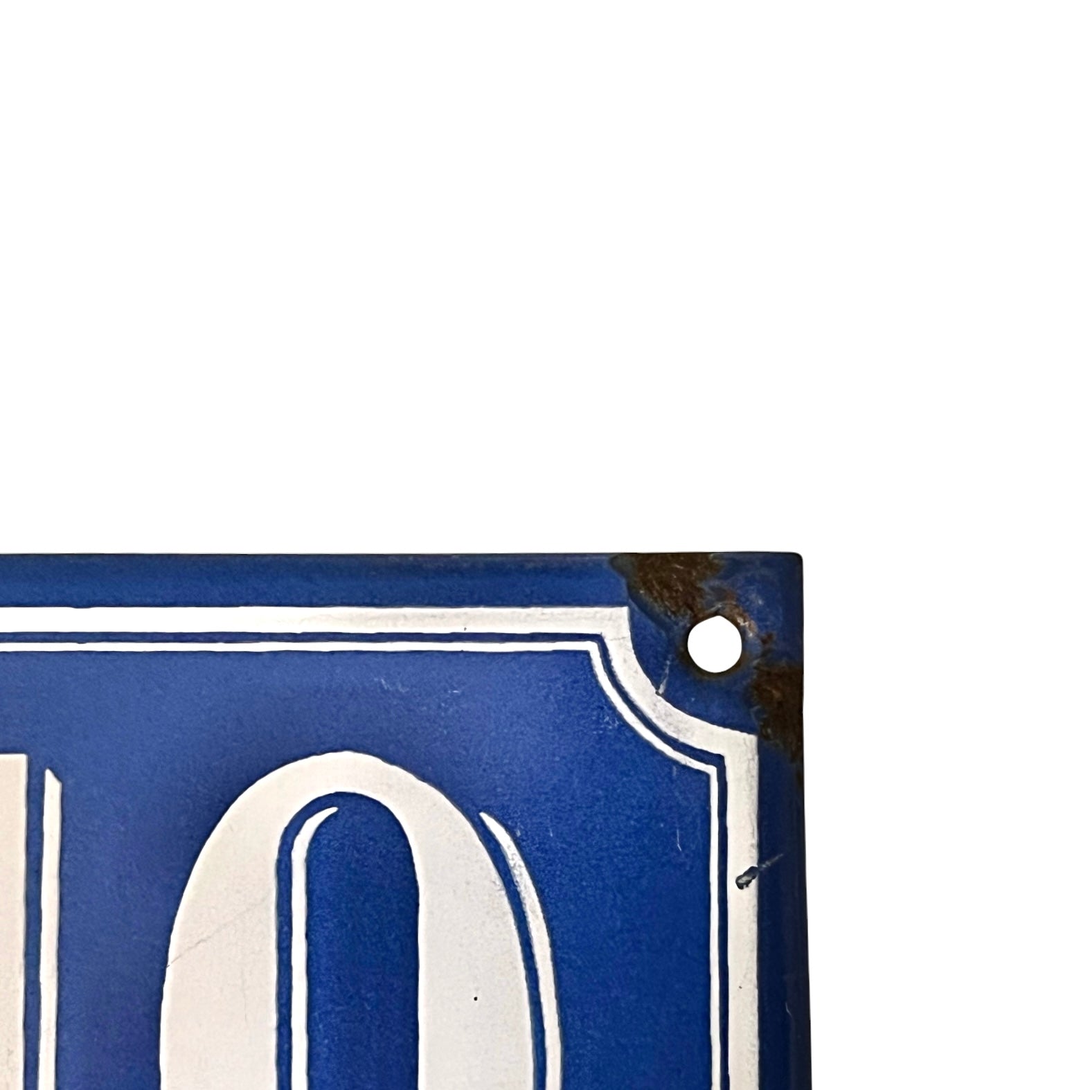 Close-up of a blue sign with white numbers on a white background