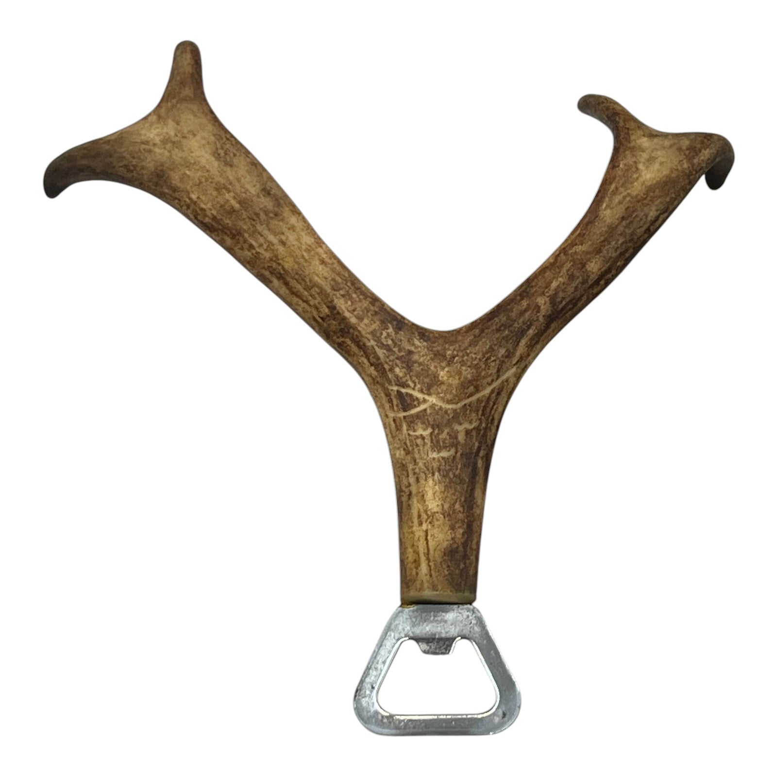 Deer antler with a metal bottle opener on a white background