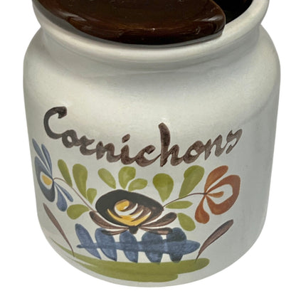 Ceramic jar with floral design and 'Carnichon' text on a white background