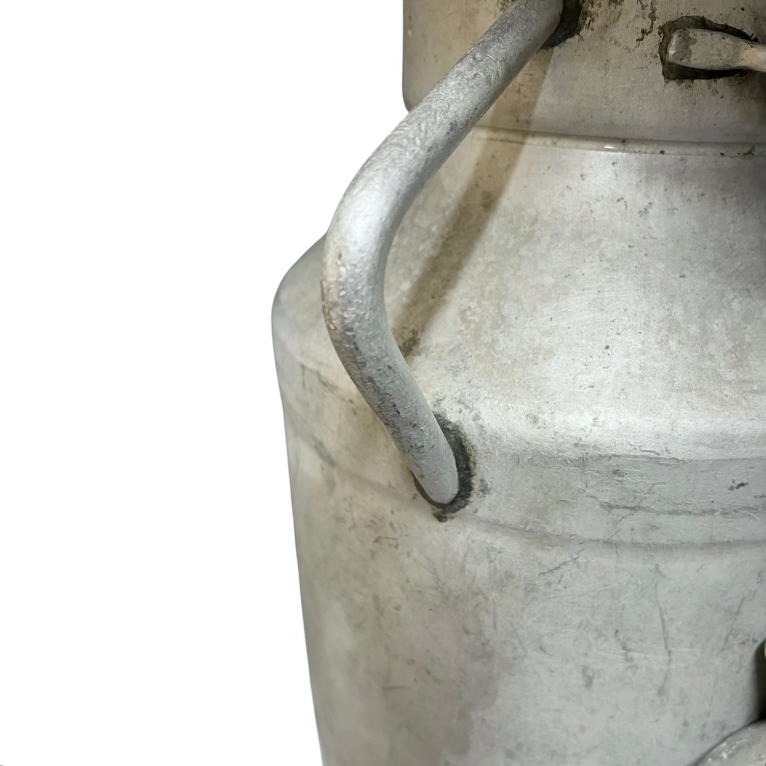 Close up of a vintage metal milk churn on a white background