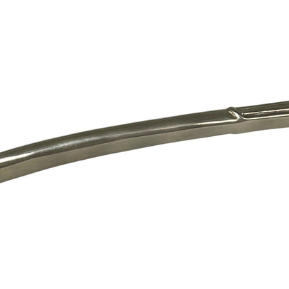 close up of a decorative Christmas tree shaped silver candle snuffer on a white background