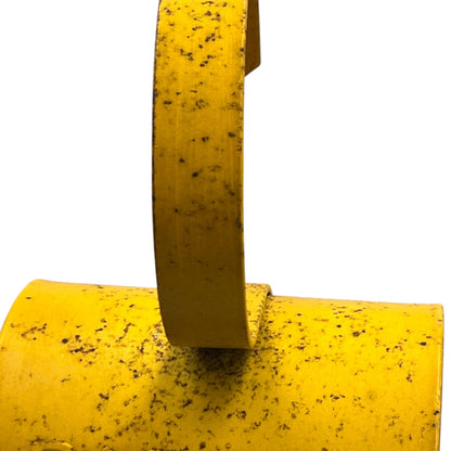 Close up of yellow vintage railway or railroad lamp with a hook on a white background