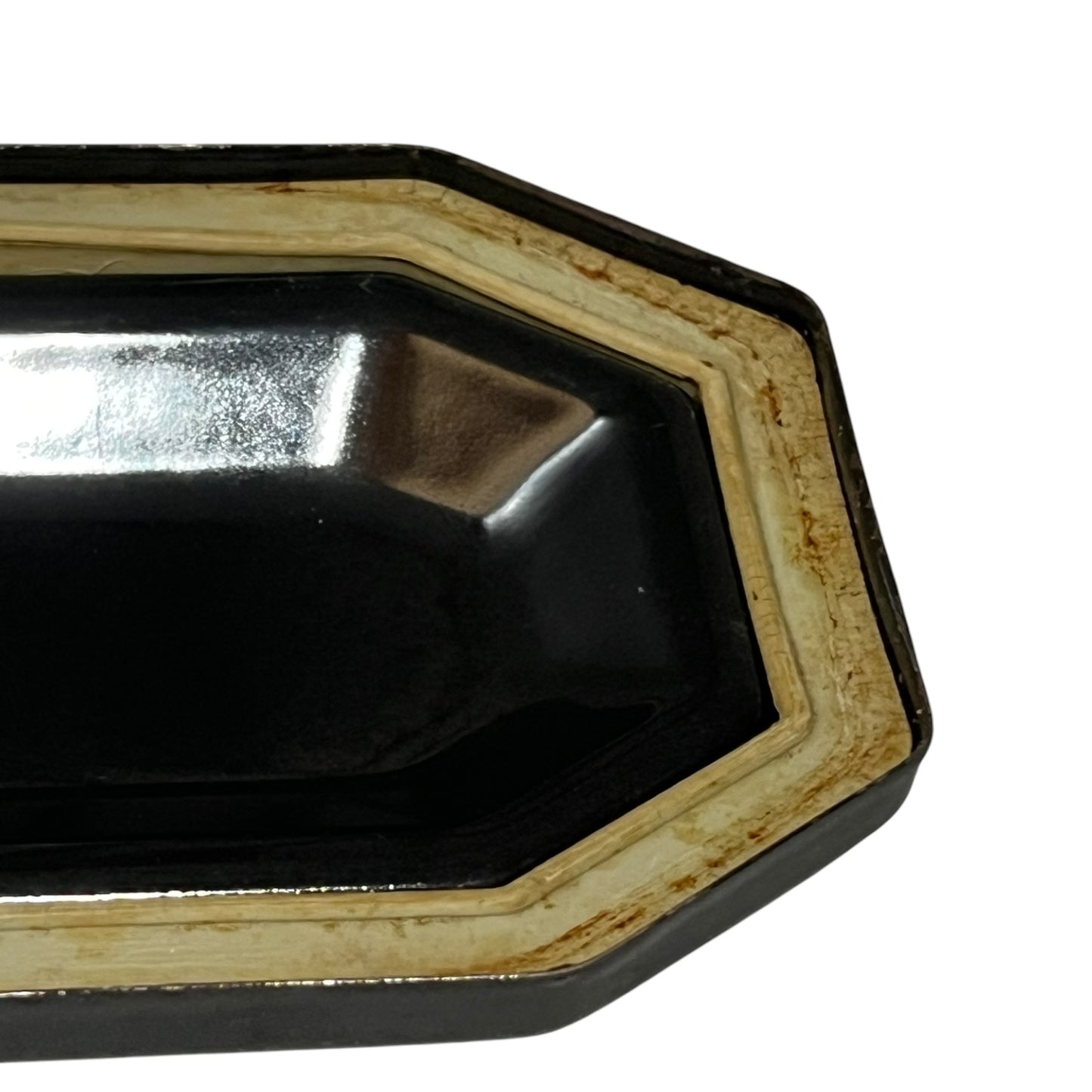 Close up of a French enamel lunch box on a white background