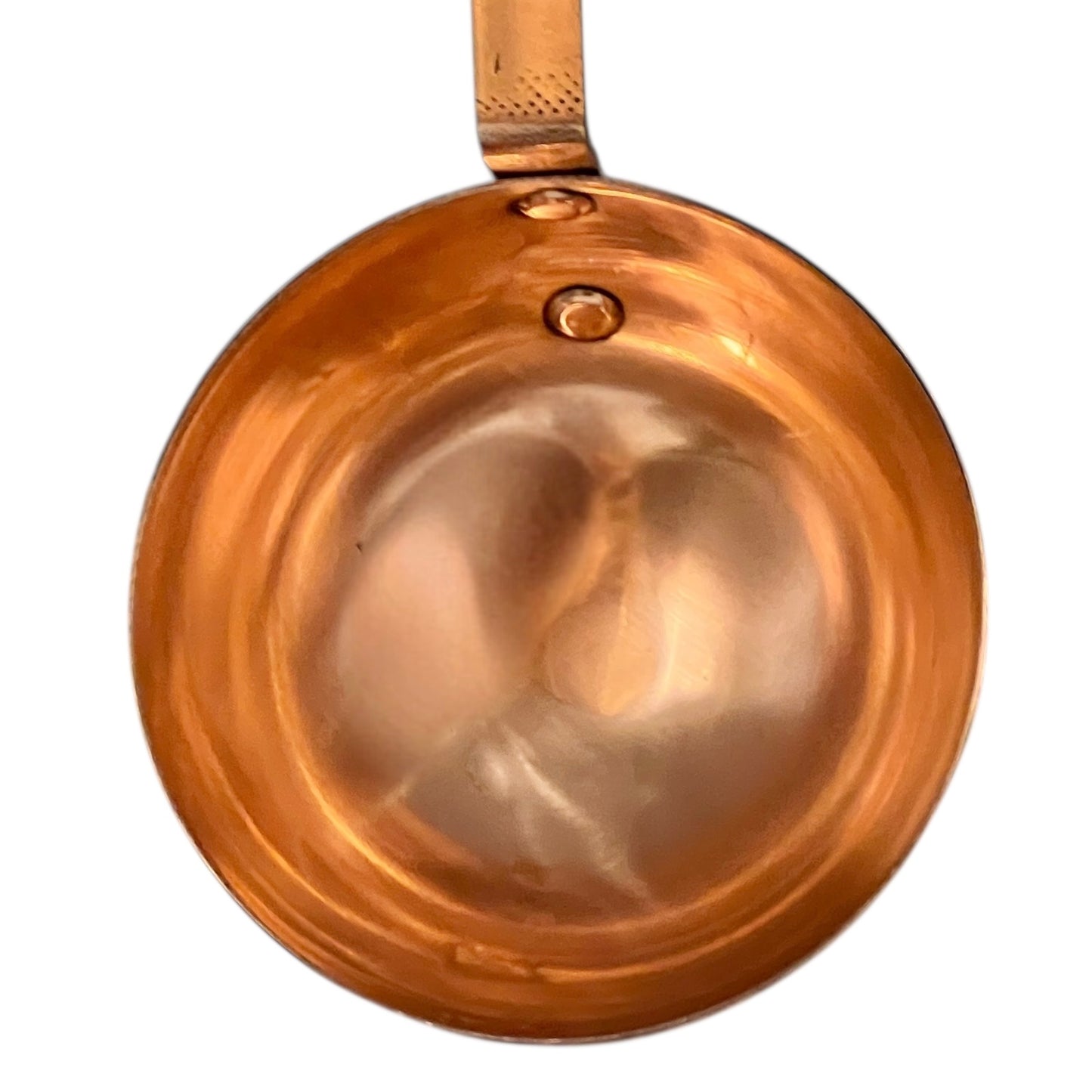 Copper ladle on a white background