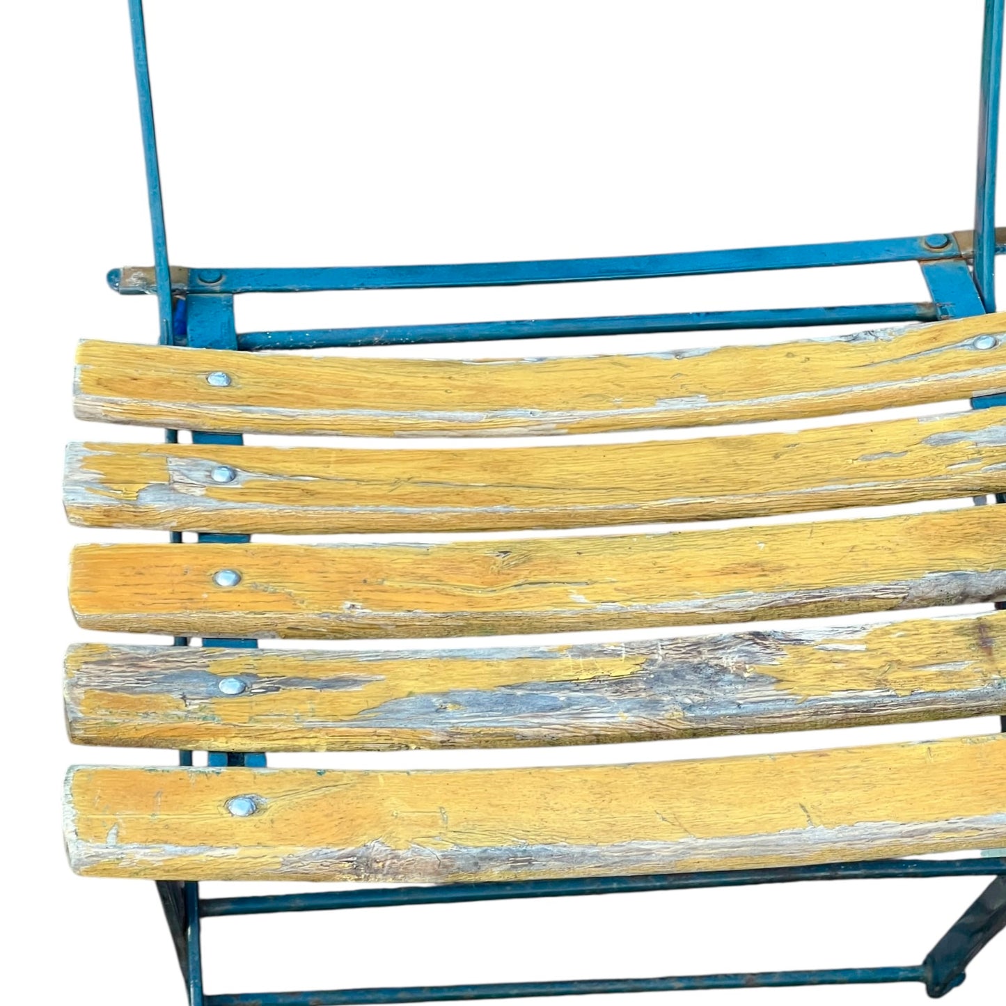 Close up of a wooden French folding chair on a white background 