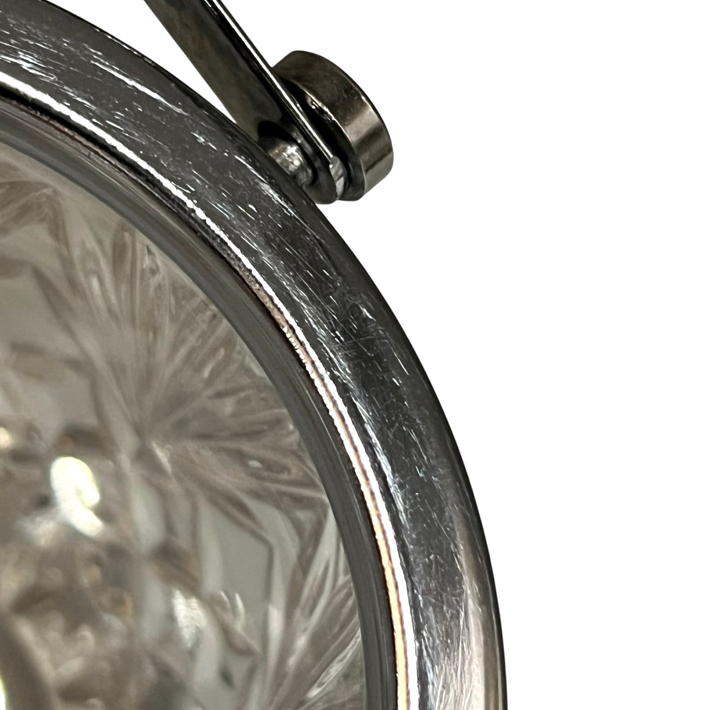 Close up of a French vintage glass ice bucket with silver rim on a white background