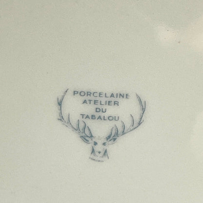 Porcelain mark with deer head design and text on the back of a plate