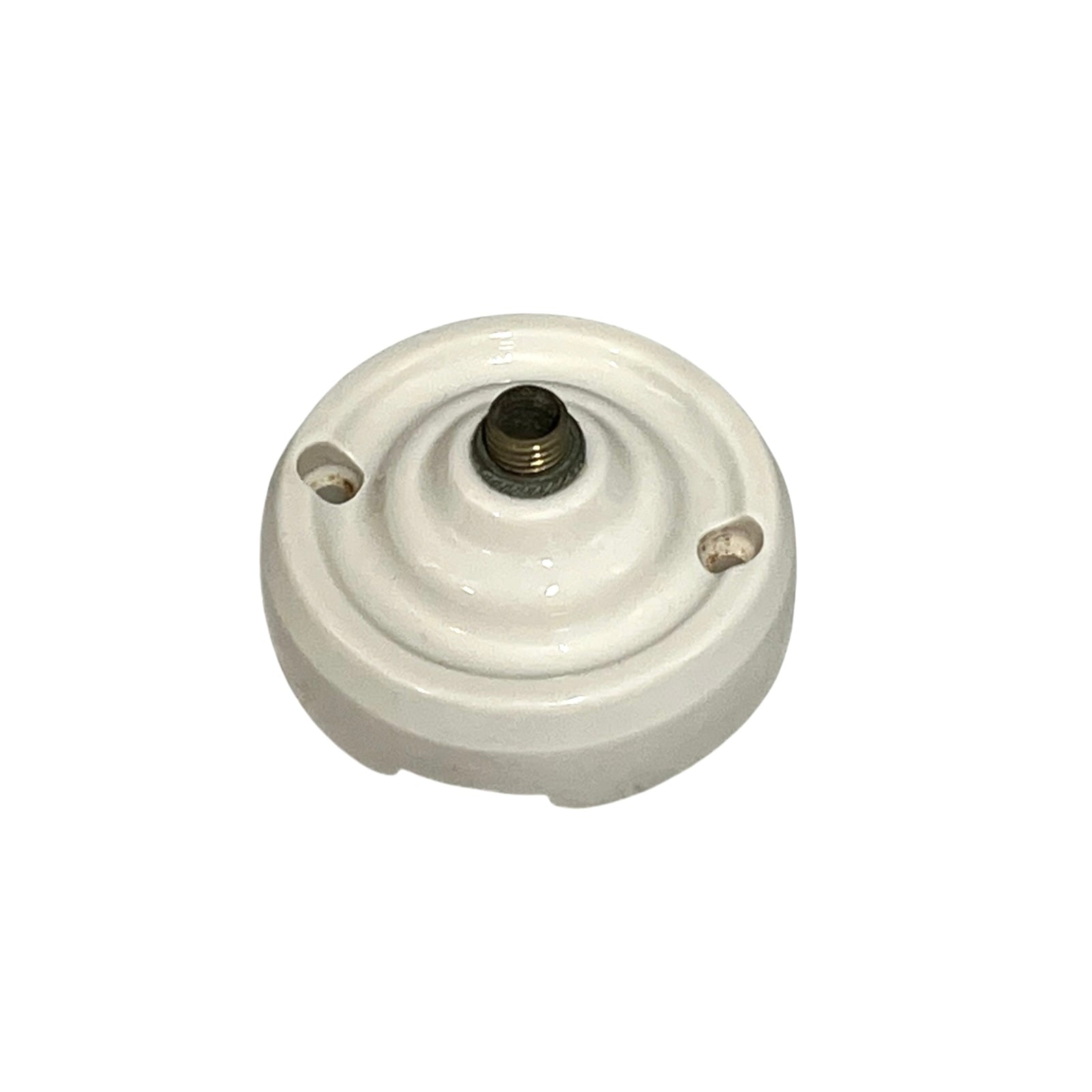 Small vintage French porcelain ceiling rose with a brass nut on a white background 