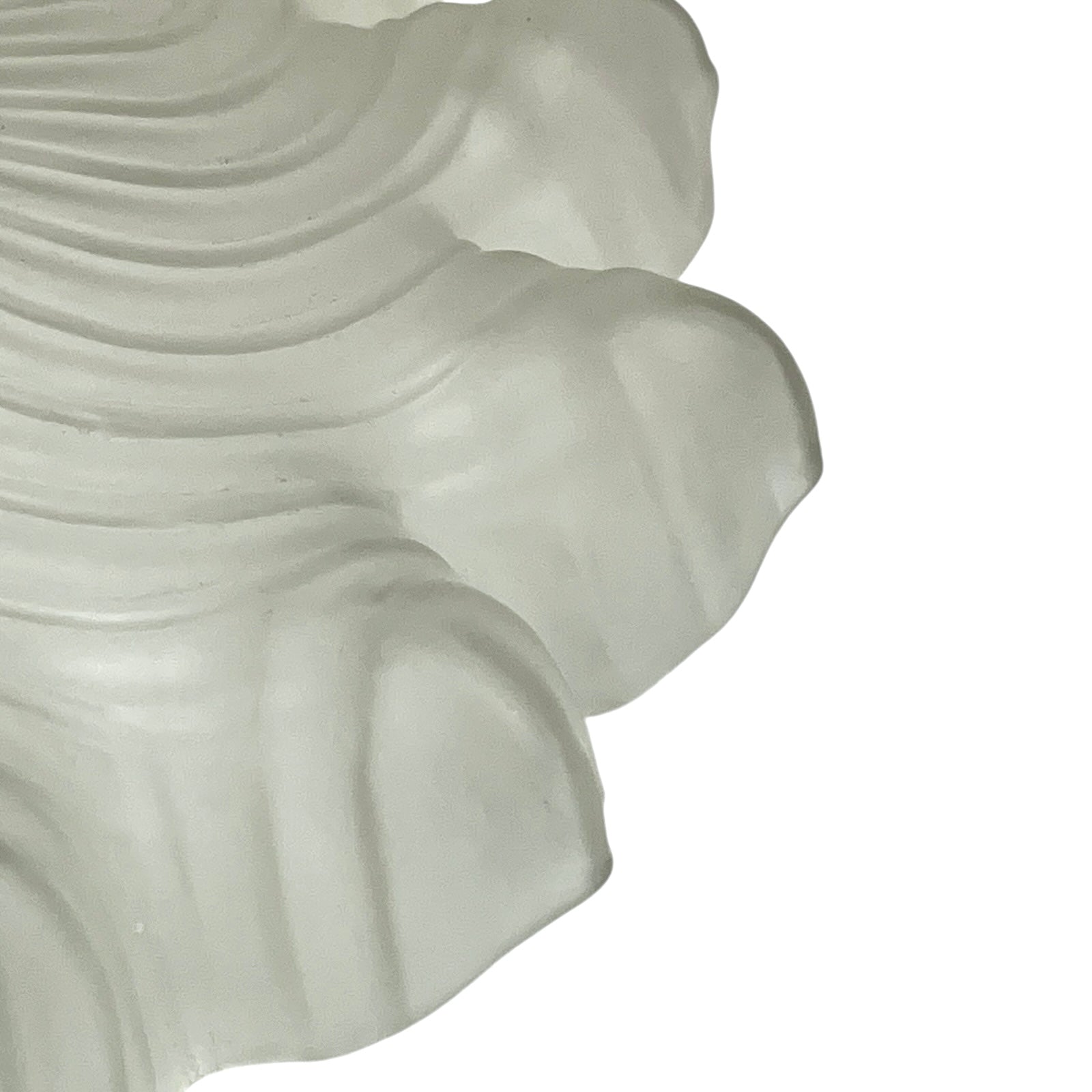 Close up of a vintage-style light fixture with frosted glass shade on a white background