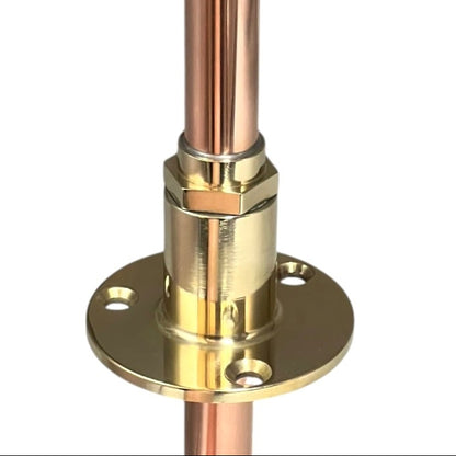Copper pipe with brass fitting on a white background