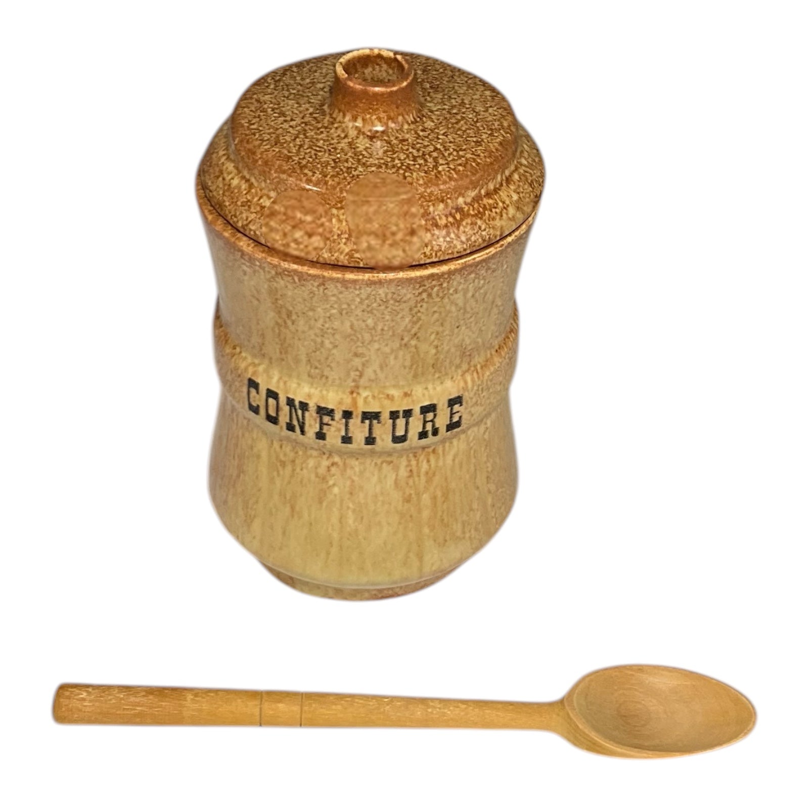 Wooden confiture jar with a lid and a wooden spoon on a white background