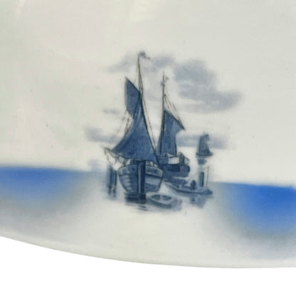 Close up of a white glass lamp shade with decorative design on a white background