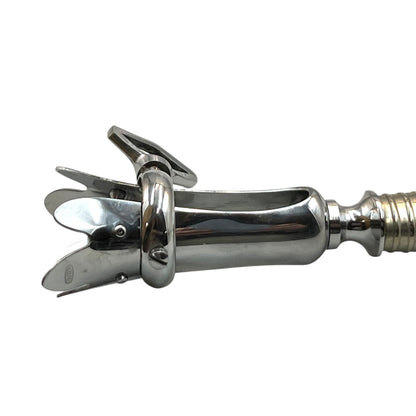 Stainless steel end of a French gigot on a white background