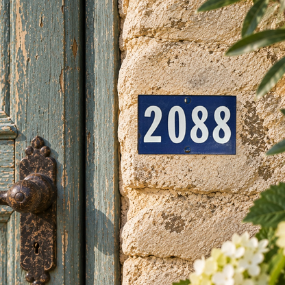 A blue house number plaque with white numerals reading 2088, mounted on a textured beige stone wall next to a weathered teal door with an ornate rusted metal handle.