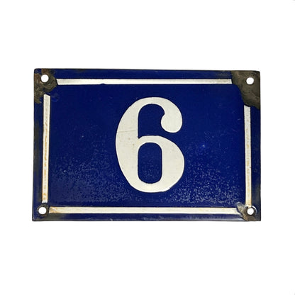 A vintage rectangular blue house number 6 plaque with a white border and weathered metal corners, shown on a plain white background.
