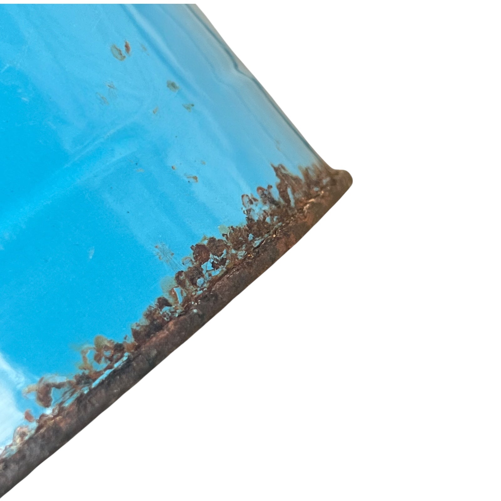 Close up of blue metal bucket with a wooden handle on a white background