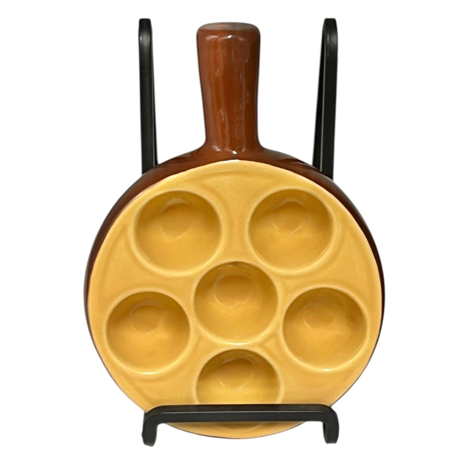 brown ceramic escargots dish with handles and a pale interior, on a white background.