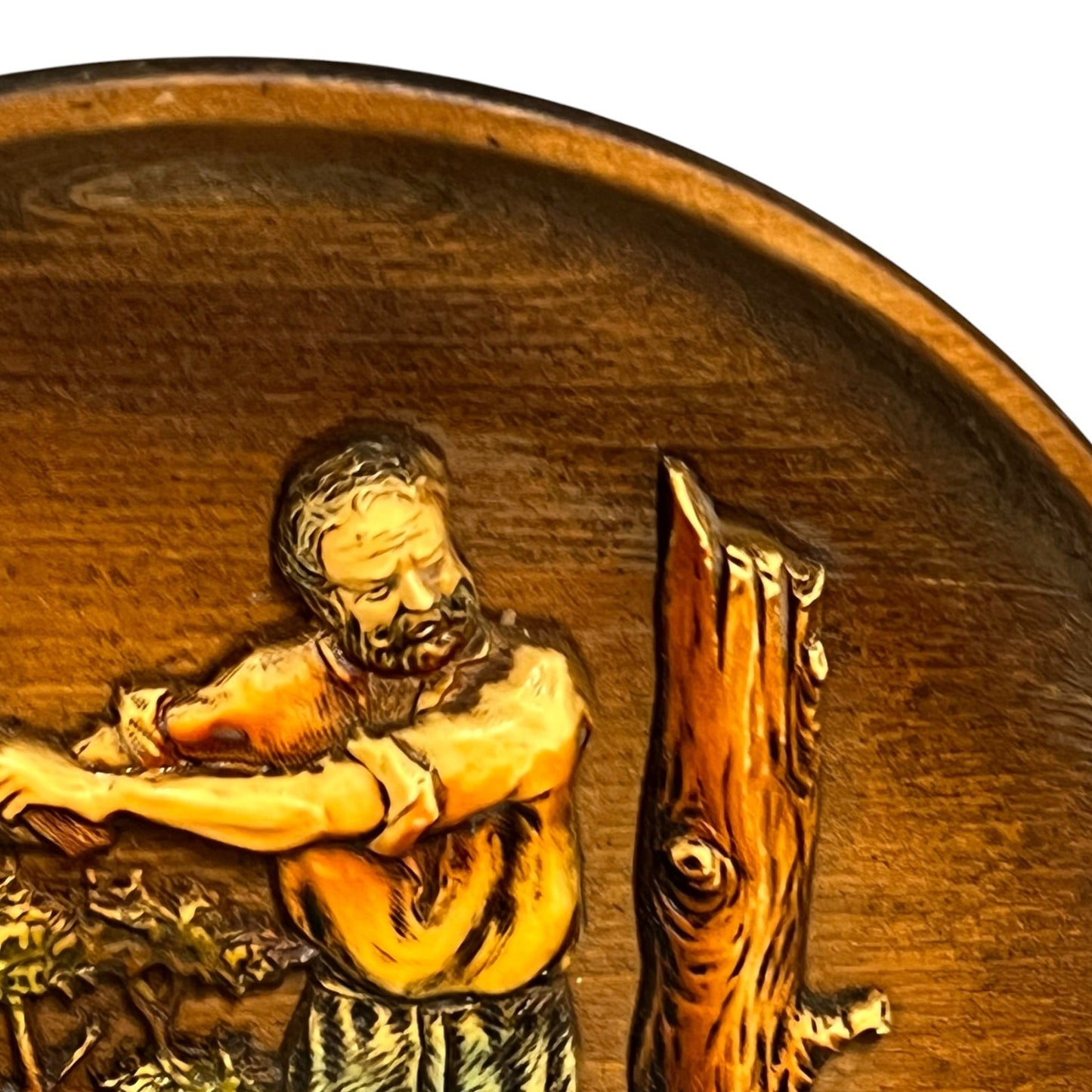 close up of a wooden decorative round plaque on a white background 