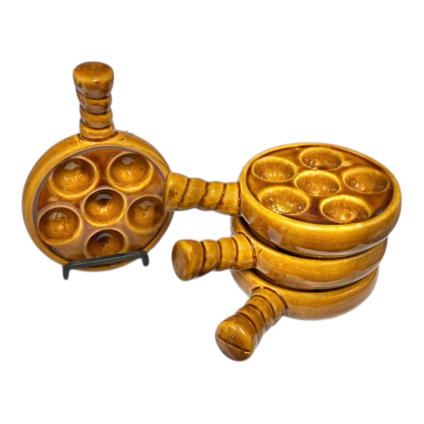 French brown ceramic escargots pots with multiple compartments on a white background