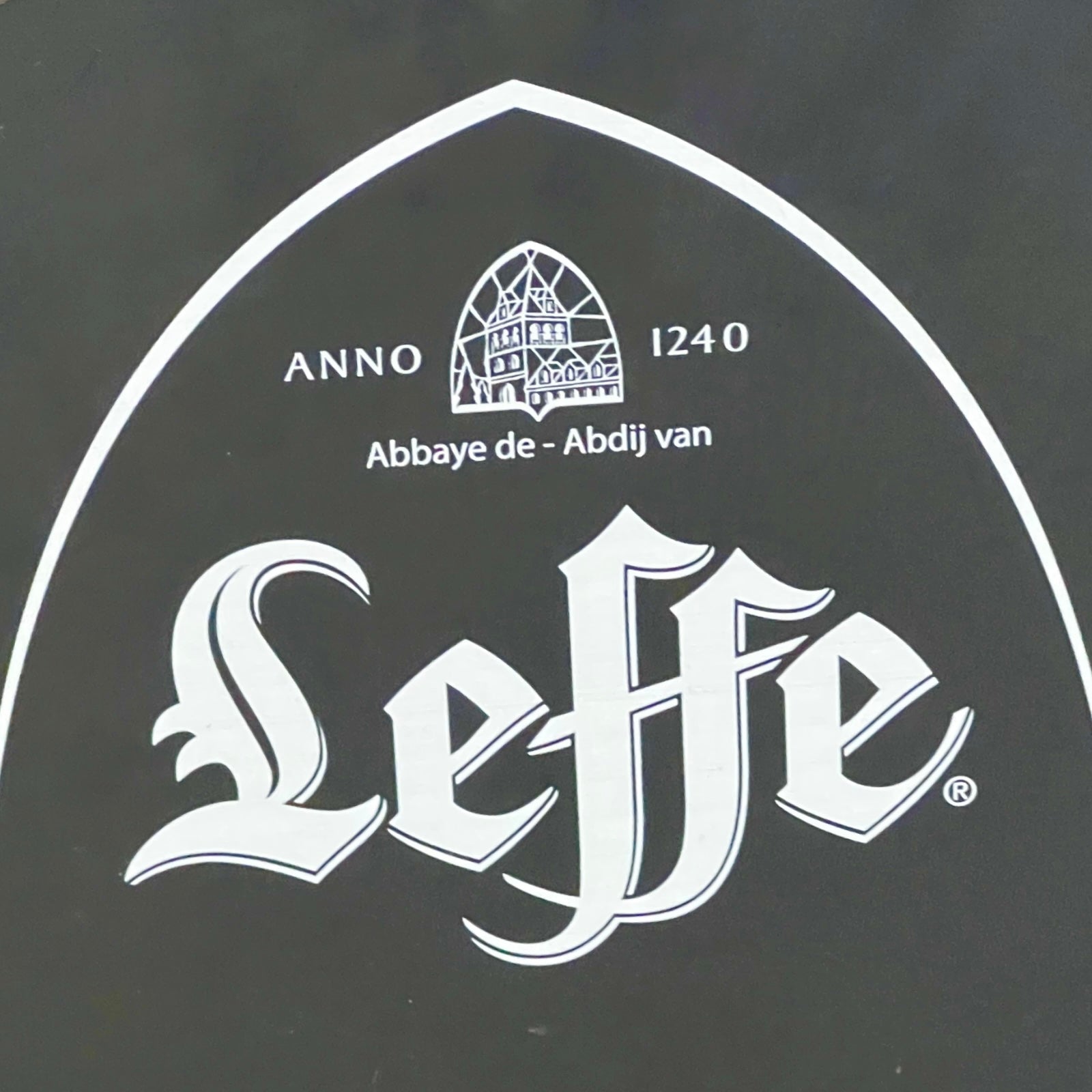 Leffe beer logo with abbey emblem on a black background