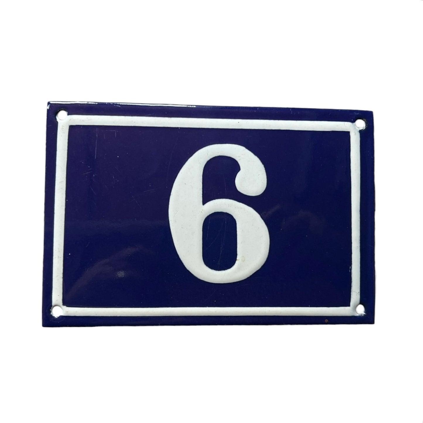 Navy blue rectangular plate with white number '6'