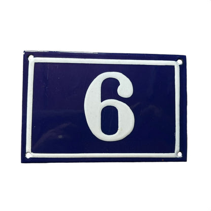 Navy blue rectangular plate with white number '6'