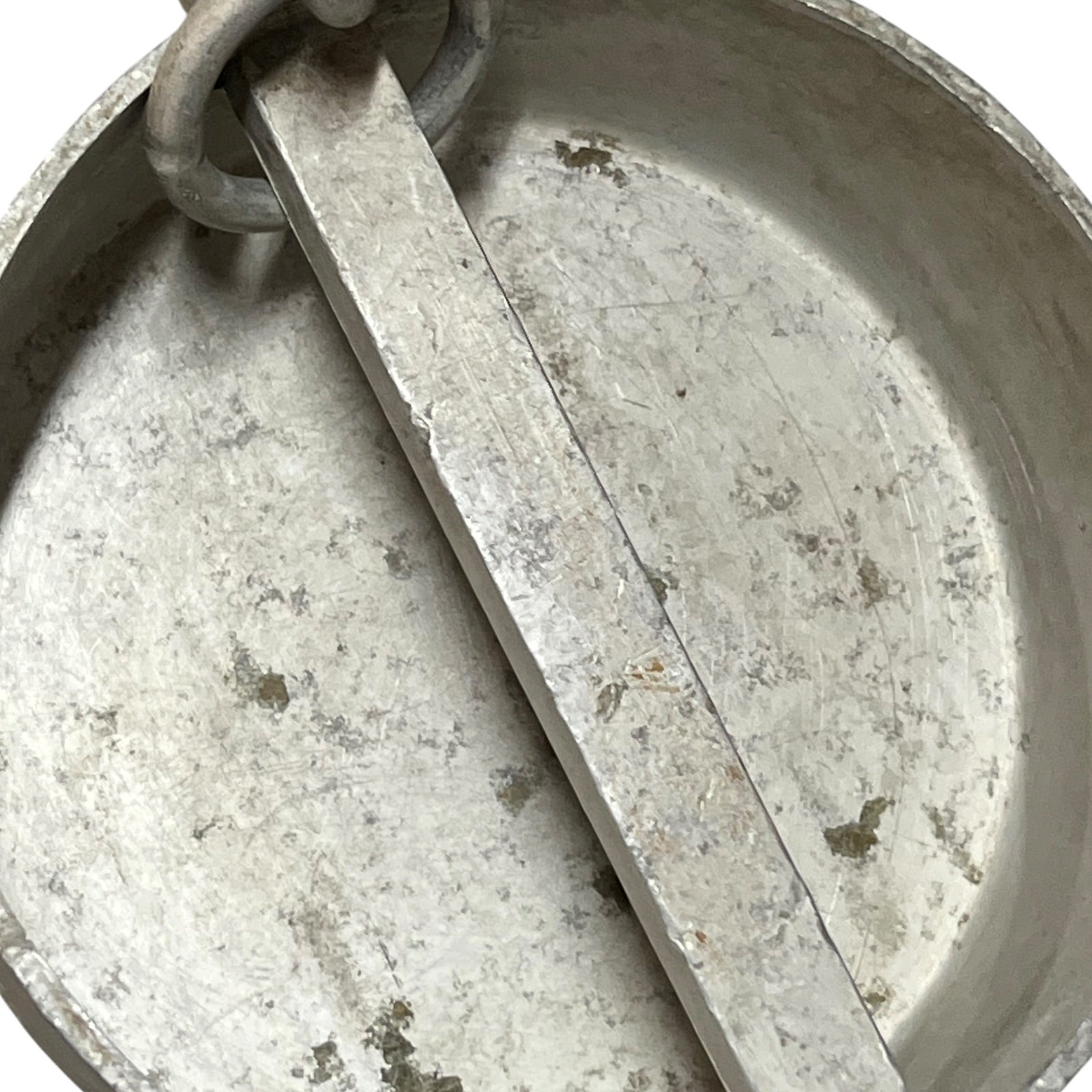 Close up of a vintage metal milk churn on a white background