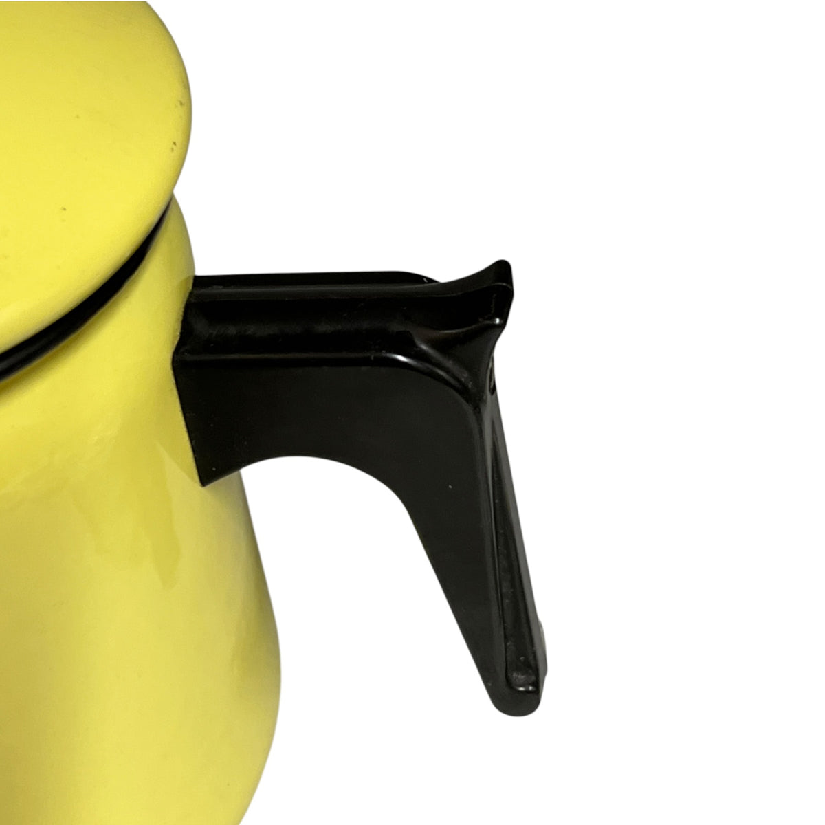 Close-up of a bright yellow enamel coffee pot or mug with a black plastic handle, shown against a plain white background.