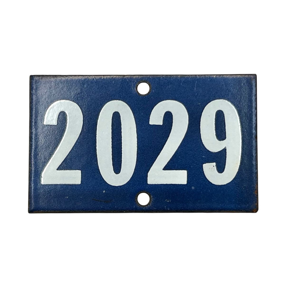 Blue and white vintage enamel door number 2029 on a white background 