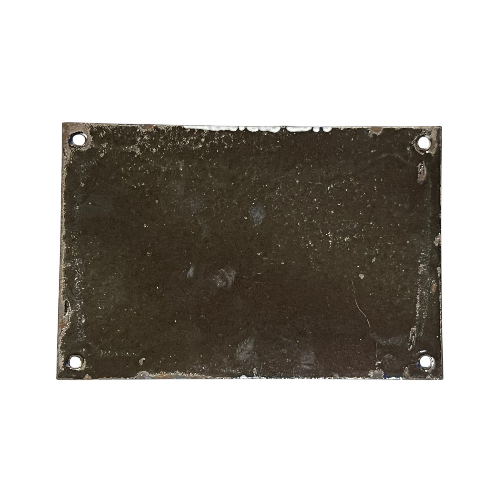 Rectangular metal plate with four holes on a white background