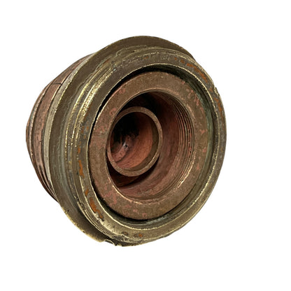 WW1 brass fuse paperweight on a white background