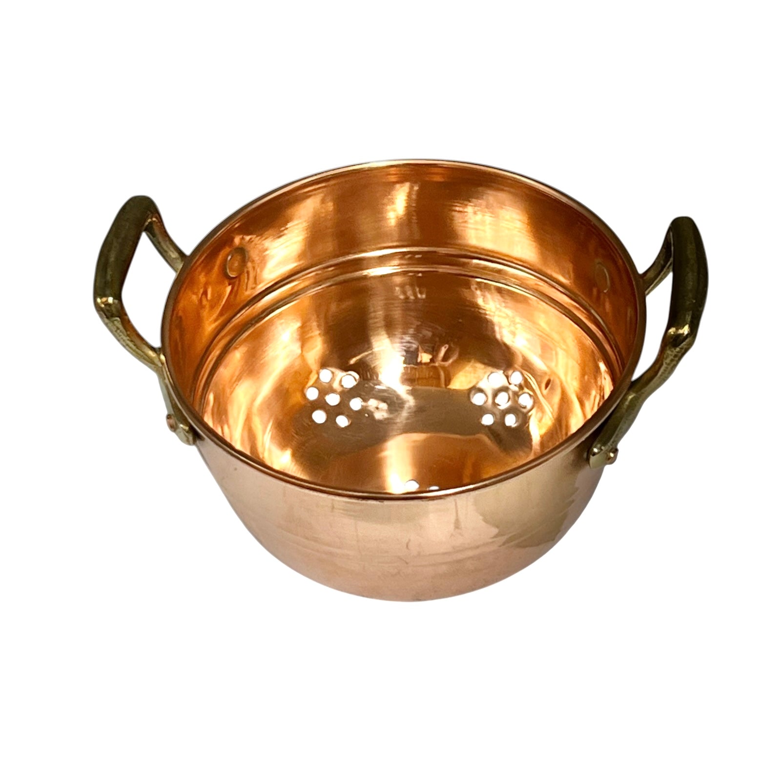 A copper colander two side handles and a perforated inner lid, shown on a plain white background 