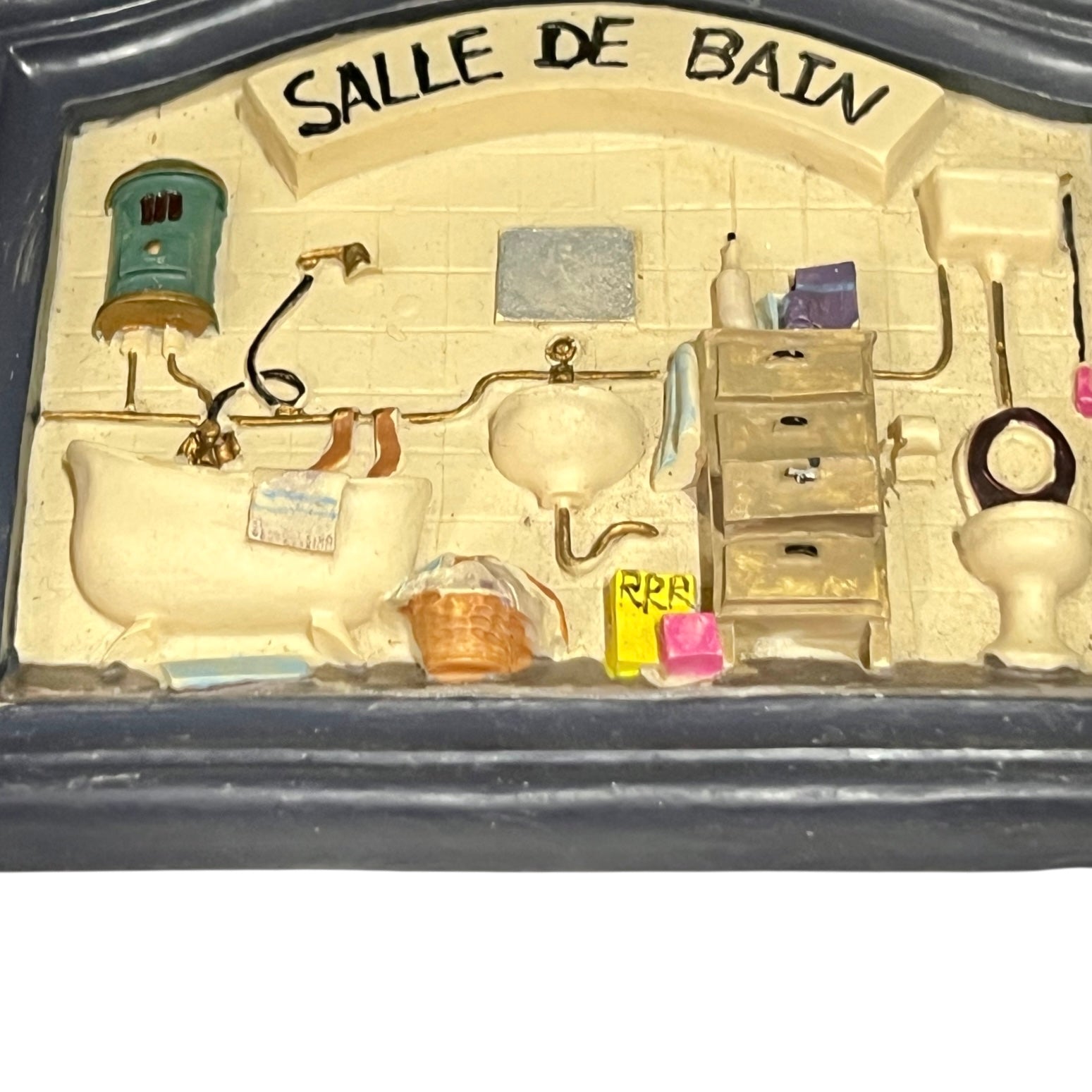 Close-up of a vintage bathroom door sign on a white background